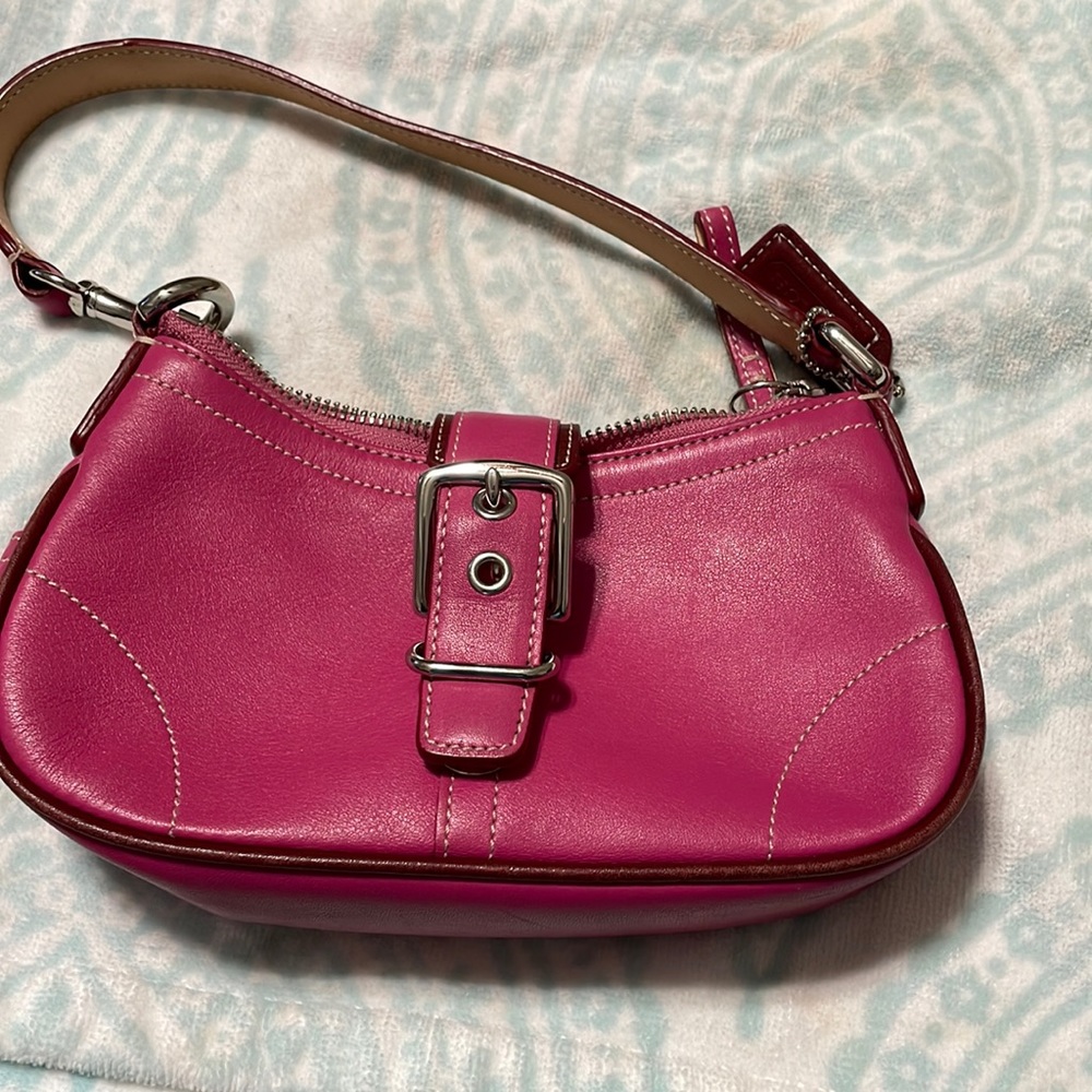This small coach bag is in excellent condition I only carried it once.
